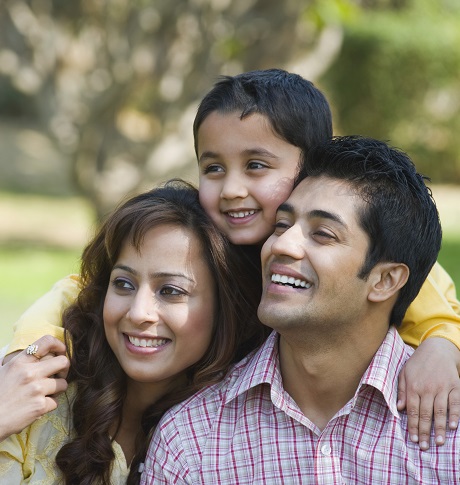 Couple with their son in a park