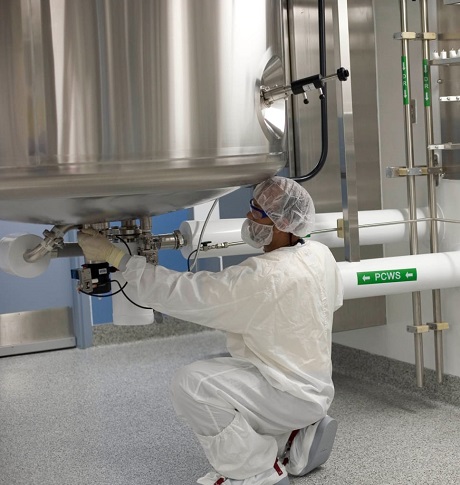 A scientist operating lab equipment